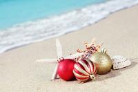 christmas baubles on the beach 